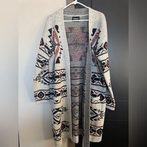 Long cardigan sweater in a colorful Aztec print. Heimish brand, fits up to a 2X